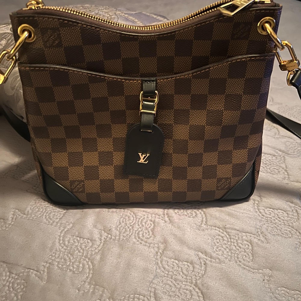 Almost new . Recent purchase , carried once .receipt , box and shopping bag .